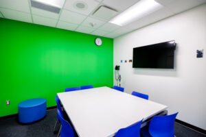 Middle School North & Spencer Loomis Elementary STEAM Addition - Media/Breakout Room for Smaller Work Groups Featuring a Green Screen.