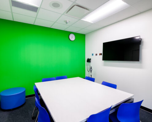 Middle School North & Spencer Loomis Elementary STEAM Addition - Media/Breakout Room for Smaller Work Groups Featuring a Green Screen.