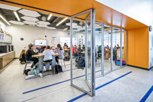 Middle School North: Classroom Lab Space Featuring Moveable Wall System. The wall system provides flexibility between closed or open sessions for experiments and collaboration.