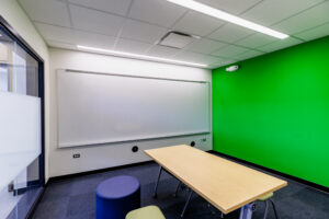 Middle School North STEAM Addition - Media/Breakout Room for Smaller Work Groups Featuring a Green Screen.