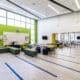 Learning Hub Space for Students to Collaborate or Conduct Experiments from their Adjacent Lab Classroom (i.e., robotics in the back right of the photo)